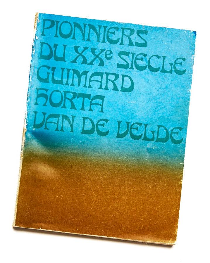 {"loading" => "lazy", "class" => "motion-reduce", "sizes" => "(min-width: 1200px) 267px, (min-width: 990px) calc((100vw - 10rem) / 4), (min-width: 750px) calc((100vw - 10rem) / 3), calc(100vw - 3rem)", "widths" => "165, 360, 535, 750, 940, 1100", "alt" => "Pionners Du XXe Guimard Horta Van De Velde", "is" => "lazy-image"}